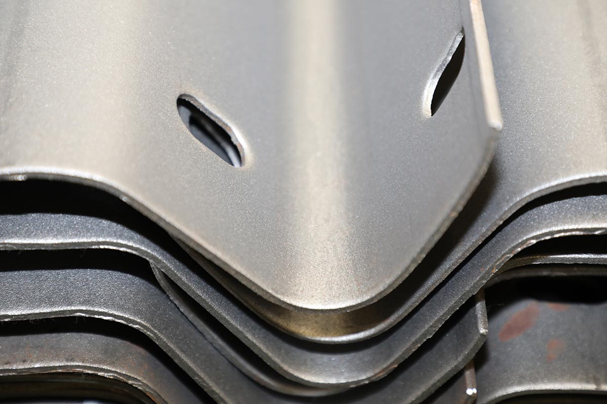 Close-Up Of Stacked Metal Parts Showcasing Precision Fabrication Quality.