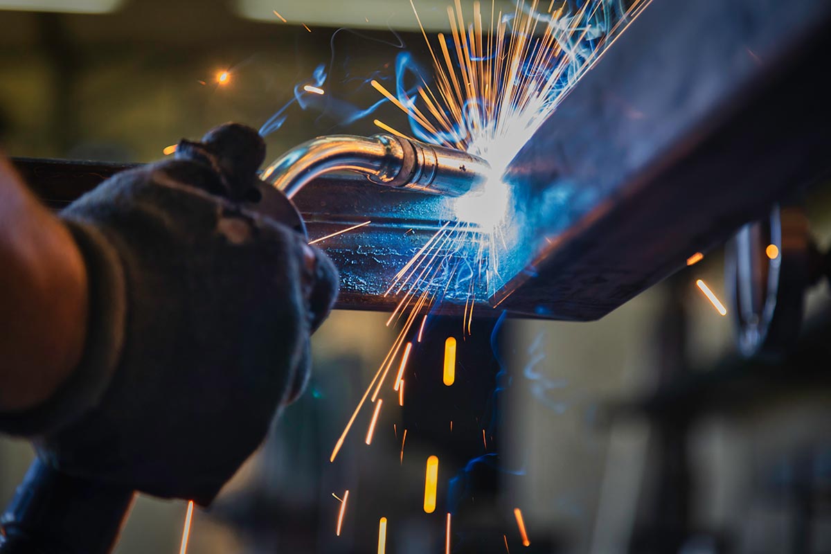 Welding-Featured Hand Welding With Sparks Flying